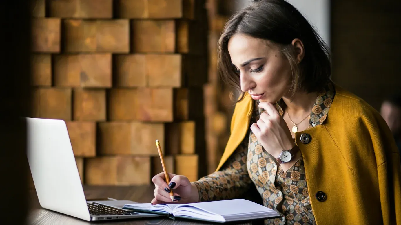 girl working on something with laptop